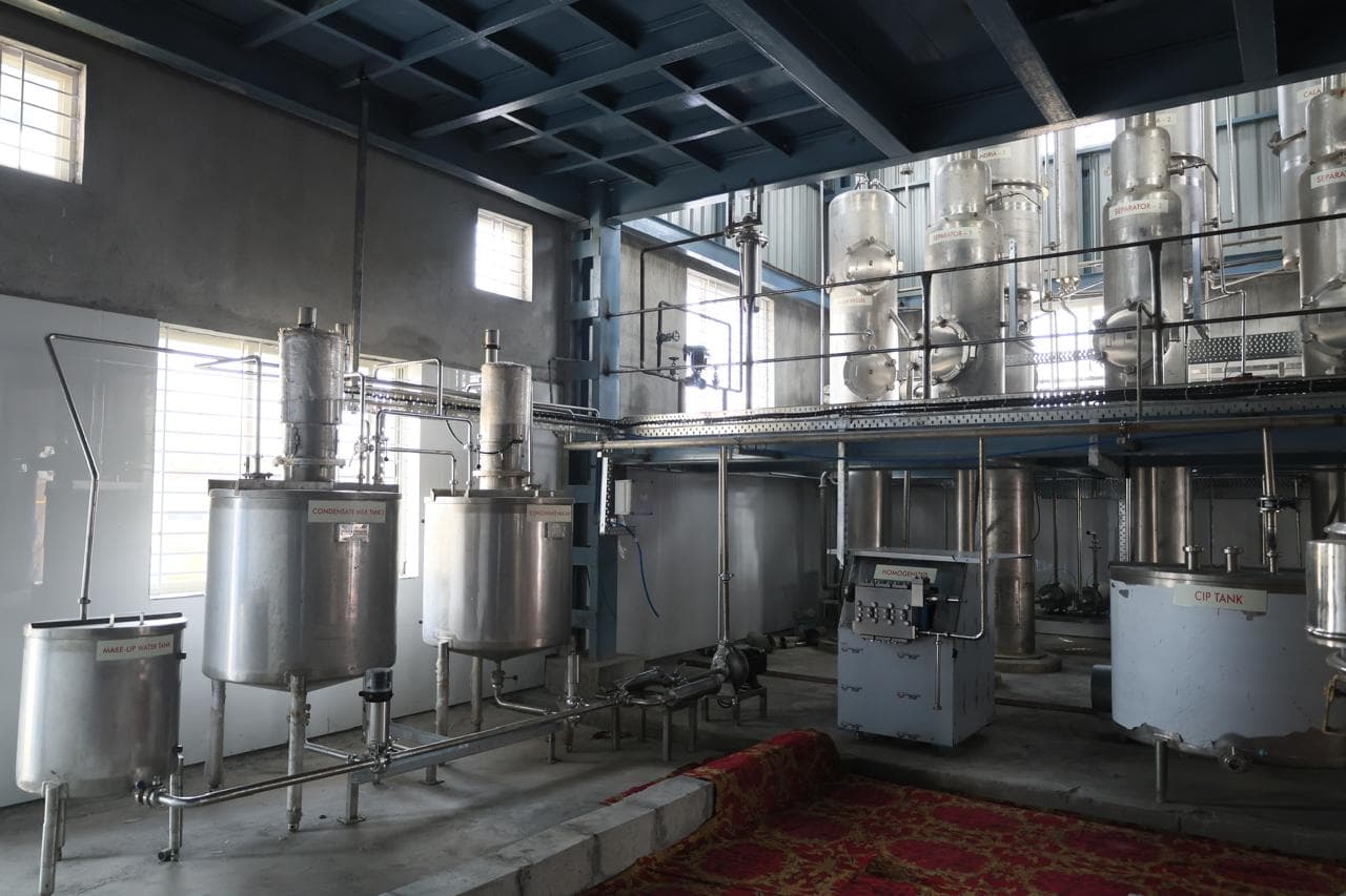 Rows of stainless steel tanks in natural light